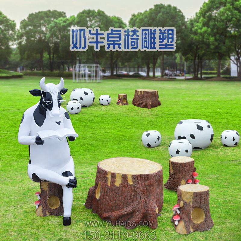 公園中一只坐著看書的奶牛桌椅玻璃鋼牛雕塑 公園中一只坐著看書的奶牛桌椅玻璃鋼牛雕塑