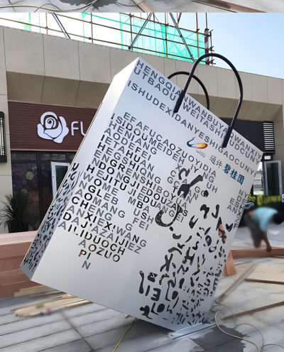 鏤空刻字大型不銹鋼購(gòu)物袋雕塑